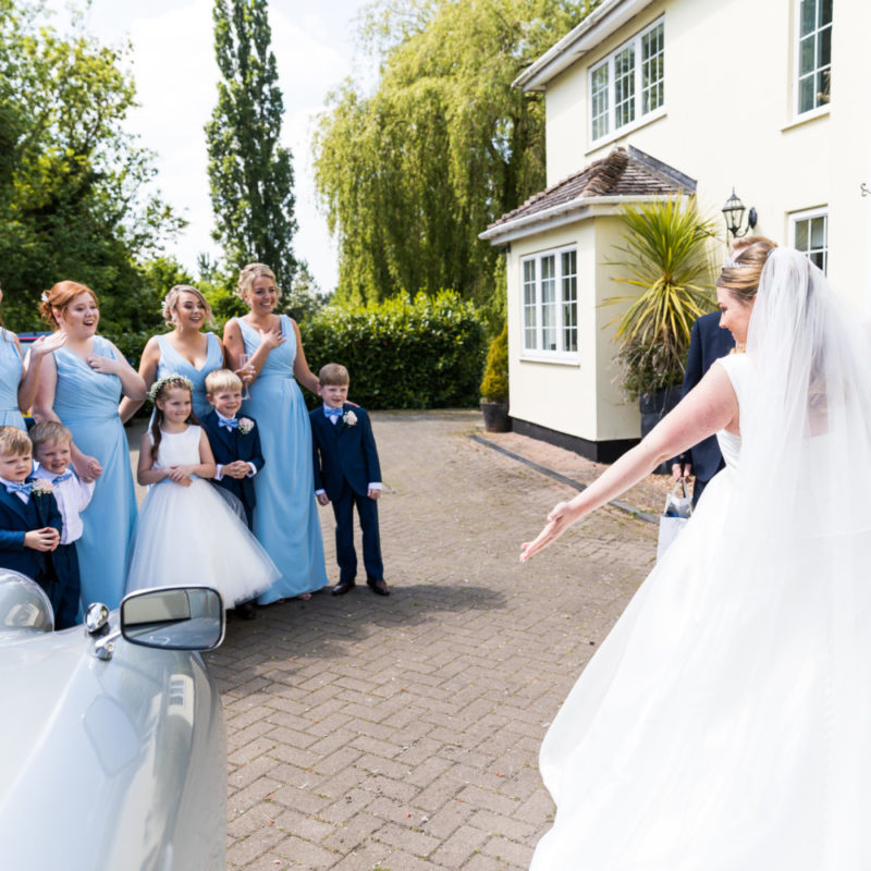 Bride showing people her dress