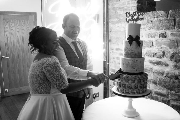 Louise Shrigley Films 3 Bride and groom cutting the cake
