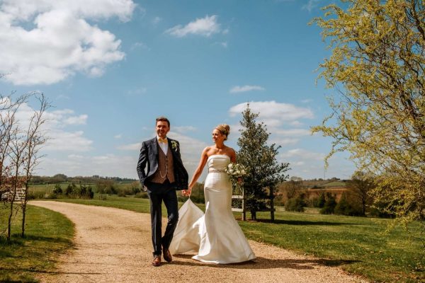 Rustic Wedding Venues Dodford Manor Barn Wedding Venue Midlands_Farm Wedding Venue Bride and Groom in fields_Hannah and Phil